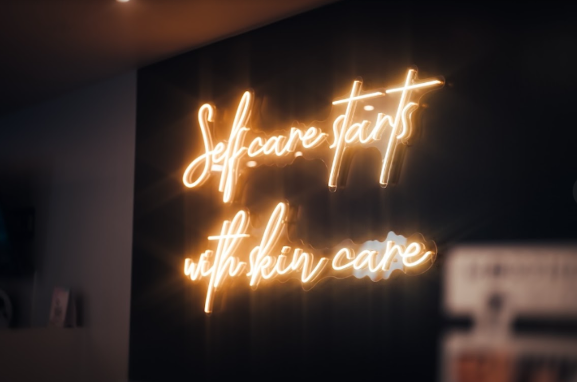 Self care starts with skin care neon sign in clinic
